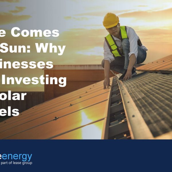 Image of person in high vis and hard hat on a roof installing solar panels, to illustrate the blog post about the benefits of solar panel leasing.