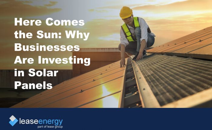 Image of person in high vis and hard hat on a roof installing solar panels, to illustrate the blog post about the benefits of solar panel leasing.