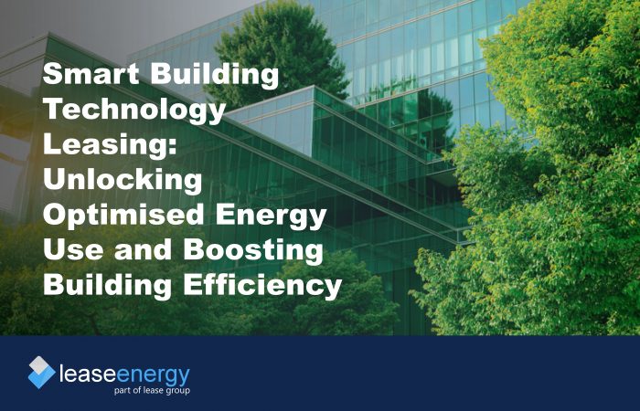 a glass building surrounded by trees to illustrate the benefits of smart building technology leasing