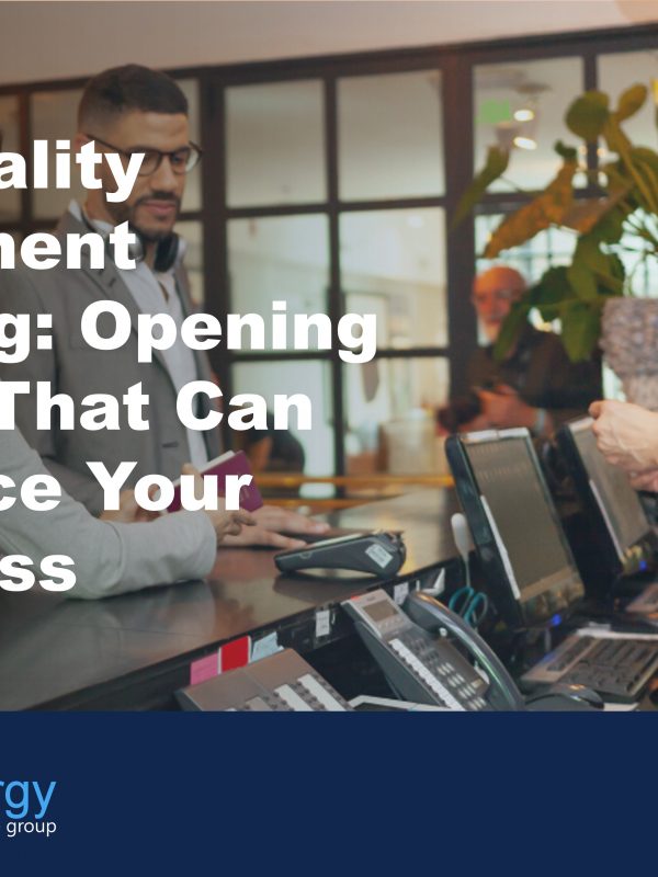 Image of couple checking in to hotel to illustrate how hospitality equipment leasing can be a benefit for hospitality businesses