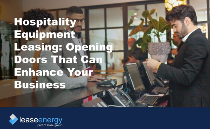 Image of couple checking in to hotel to illustrate how hospitality equipment leasing can be a benefit for hospitality businesses