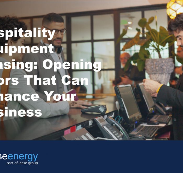 Image of couple checking in to hotel to illustrate how hospitality equipment leasing can be a benefit for hospitality businesses